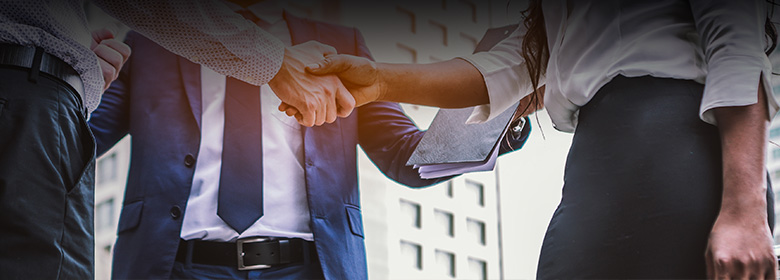 Better customer relationships with Dynamics 365 Sales Businessmen shaking hands